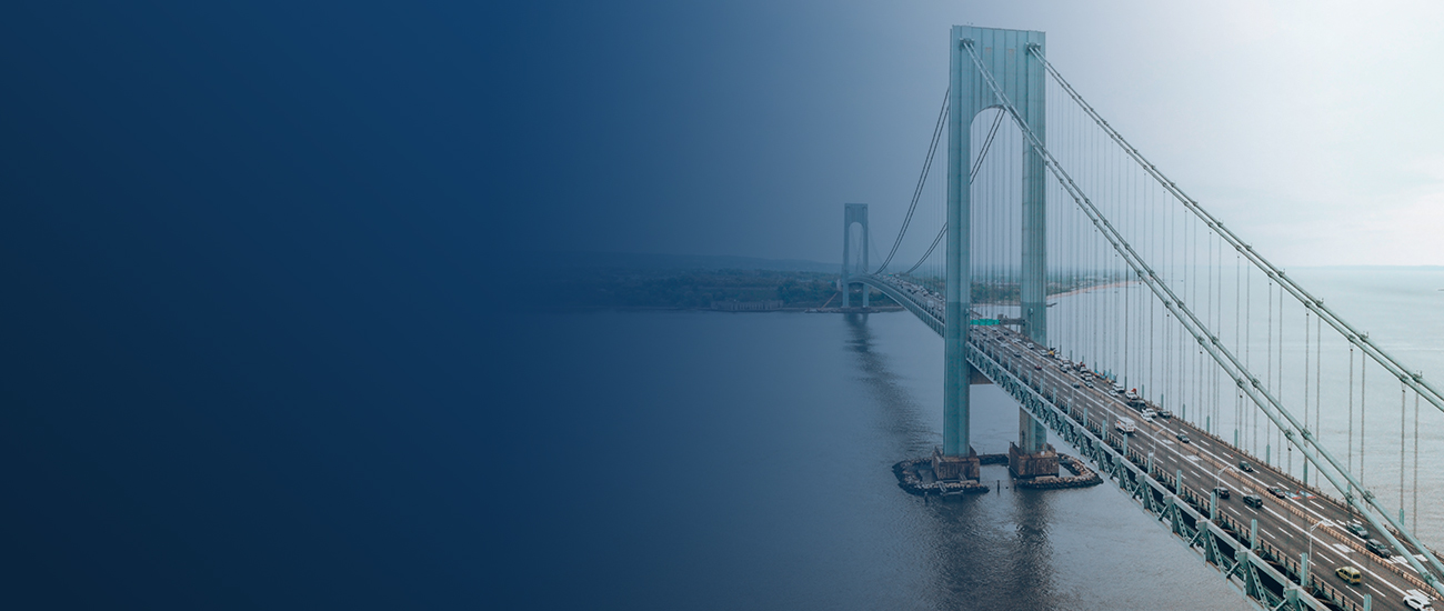 Suspension bridge over misty waters