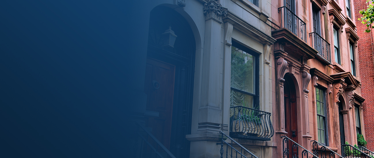 Row of brownstone townhouses.